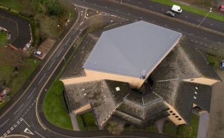 The Kerith Community Church’s sloped fan-shaped roof with new Sika Sarnafil G410-18ELF Lead Grey membrane