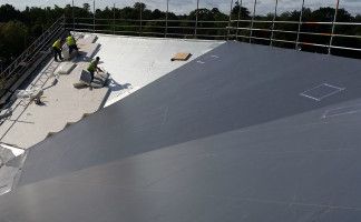 The Kerith Community Church’s sloped fan-shaped roof with new Sika Sarnafil G410-18ELF Lead Grey membrane