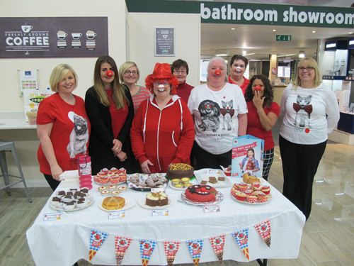 Covers staff selling cakes during the Red Nose Day event
