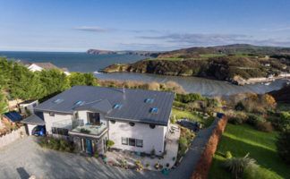 The home, which sits on the Pembrokeshire coastline, is able to withstand the rigors of coastal weather and remain well insulated [Photo Credit: Daniel Smart Photography]