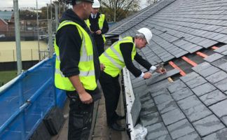 The tiles being fixed to the roof