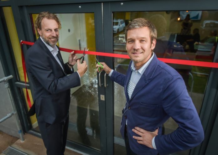 Andy Dunkley, CEO at CMO (left) opening the company's new office with Charlie Luxton