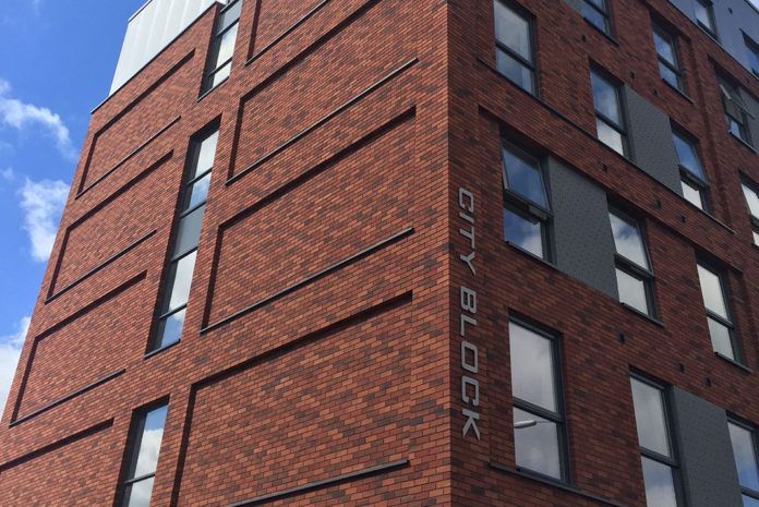 An external wall insulation and brick slip façade combination from Sto has been used to create attractive new elevations for the CityBlock building in Reading.