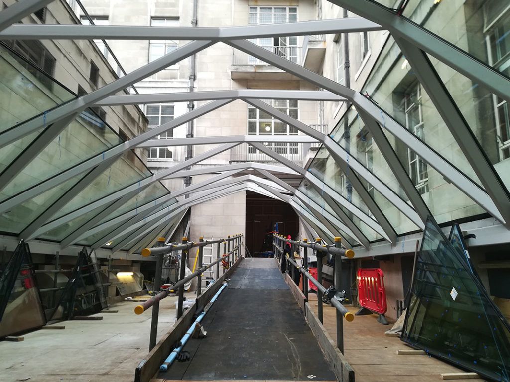 The Senate House roof in construction where 105 unique glass panels were bonded using Sikasil-SG 500 structural silicone to a steel frame. Photo provided by Cantifix. 