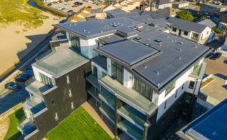 The Dunes development in Perranporth: The challenge was to create effective waterproofing and weather resistant solutions for both the roof and balconies.