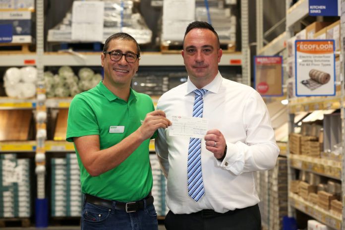 Left to right: Paul Lyons, regional fundraising manager - London, at Macmillan, receives a cheque from Roy Barnard, branch general manager at Selco Builders Warehouse
