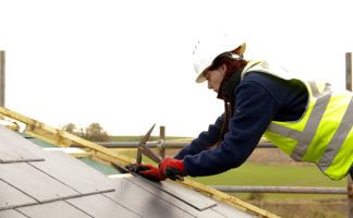 Hanna Weaver refines her slate cutting and laying skills on-site