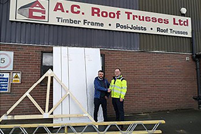 Osian Jones, truss and easi joist development manager for the Huws Gray Group, and Tom Jones, managing director for AC Roof Trusses