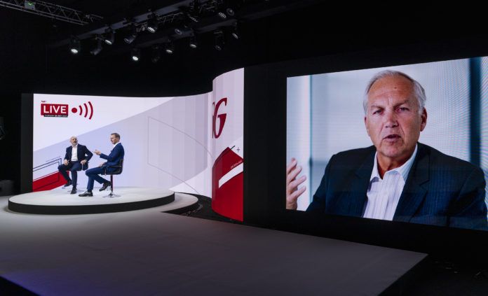 Left to right: Philip Johns, managing director of SIG UK speaks to BBC TV presenter Dan Walker in the studio, with Steve Francis, chief executive officer of SIG Group on the screen