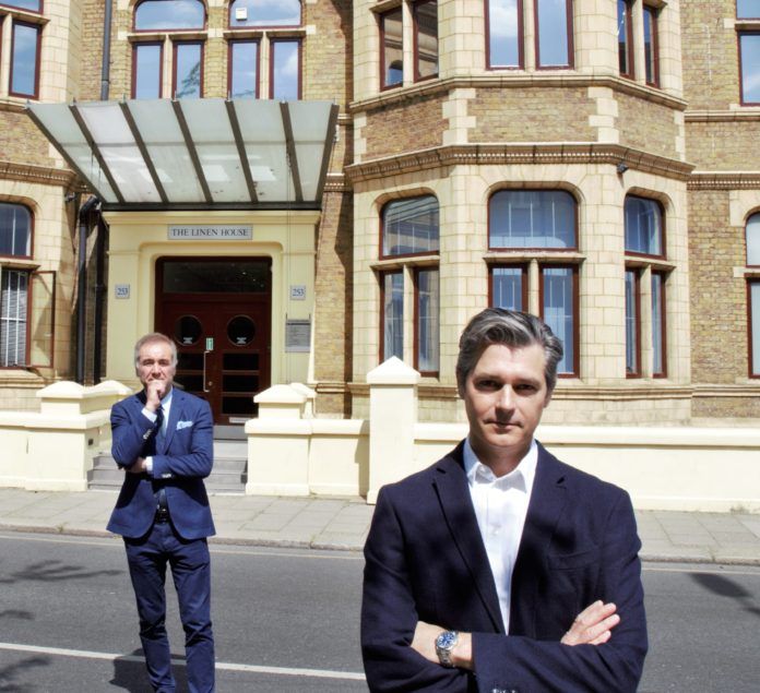 Peter Johnson (left) with James Butler (right) outside Pura Facades' new office in Kilburn, west London