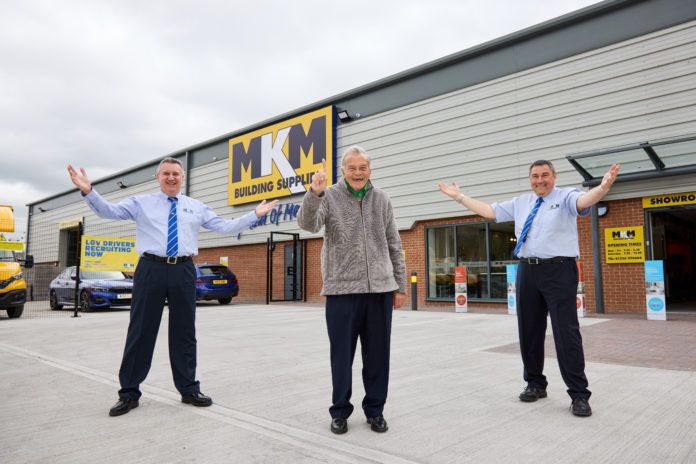 Cricket legend Dickie Bird officially opens MKM Building Supplies' new Barnsley branch with co-branch directors Mark Winstanley and John Lea.