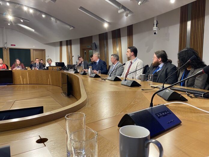 Roundtable guests discussing Scottish retrofit strategies.