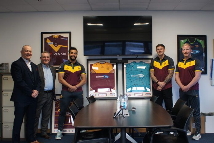 Pictured (L to R): Brian Blacker (commercial manager, Huddersfield Giants), Dean Morgan (managing director, Bond It) and Ashton Golding, Liam Sutcliffe and Matty English (Huddersfield Giants).